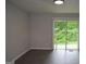 View of living room showcasing luxury vinyl floors and a sliding glass door at 6286 Saddlewood Dr, Lithonia, GA 30058