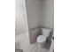 Bathroom with a shower and toilet featuring tile flooring and coordinated finishes at 686 Favorwood Sw Dr, Marietta, GA 30060