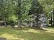 Beautiful home surrounded by mature trees, offers a serene and private setting with ample green space at 686 Favorwood Sw Dr, Marietta, GA 30060