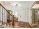 Bright foyer showcasing hardwood floors, staircase, and elegant details at 10875 Shagbark Trl, Roswell, GA 30075