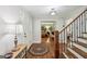 Bright foyer showcasing hardwood floors, staircase, and elegant details at 10875 Shagbark Trl, Roswell, GA 30075