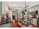 Well-appointed kitchen featuring stainless steel appliances, hardwood floors, and a convenient center island at 10875 Shagbark Trl, Roswell, GA 30075