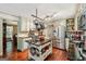 Spacious kitchen boasts stainless appliances, ample cabinet space, and a functional center island with pot rack at 10875 Shagbark Trl, Roswell, GA 30075