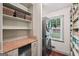 Pantry with shelving and laundry facilities; includes window to the exterior at 10875 Shagbark Trl, Roswell, GA 30075