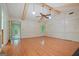 Bright living room with hardwood floors, wainscoting and large windows that provide ample light at 1977 Kensington High Sw St, Lilburn, GA 30047