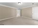 Neutral bedroom with carpet flooring features a door to a bathroom and a closet at 607 Lees Mill Rd, Fayetteville, GA 30214