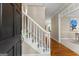 Elegant foyer showcasing a staircase, hardwood floors, and an inviting entrance at 607 Lees Mill Rd, Fayetteville, GA 30214