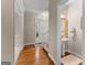 Bright foyer with hardwood floors, a view to the front door, and a half bathroom at 607 Lees Mill Rd, Fayetteville, GA 30214