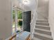 Warm and inviting foyer featuring hardwood floors and views of the outdoors at 607 Lees Mill Rd, Fayetteville, GA 30214