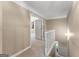 Upstairs hallway with a view of the staircase at 607 Lees Mill Rd, Fayetteville, GA 30214