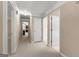Bright hallway with neutral carpet offers access to multiple rooms at 607 Lees Mill Rd, Fayetteville, GA 30214