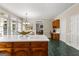 Well lit kitchen with an island, patterned tile flooring, and view to living room at 607 Lees Mill Rd, Fayetteville, GA 30214