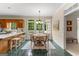 Kitchen dining area features a chandelier, table, chairs and a view through the windows to the outside at 607 Lees Mill Rd, Fayetteville, GA 30214