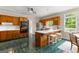 Eat-in kitchen featuring tile floor, stainless appliances and a kitchen island with bar seating at 607 Lees Mill Rd, Fayetteville, GA 30214