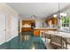 Spacious kitchen with tile flooring, a view of dining area and access to other rooms at 607 Lees Mill Rd, Fayetteville, GA 30214