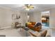 Cozy living room with plush seating, stylish decor, and a view into the kitchen area at 607 Lees Mill Rd, Fayetteville, GA 30214