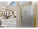 Bright main bathroom featuring a shower and soaking tub at 607 Lees Mill Rd, Fayetteville, GA 30214