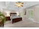 Spacious main bedroom with trey ceiling, carpet, and a ceiling fan at 607 Lees Mill Rd, Fayetteville, GA 30214