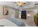 Comfortable primary bedroom with fireplace and access to balcony at 607 Lees Mill Rd, Fayetteville, GA 30214