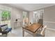 Sunlit home office featuring neutral paint, large windows, and comfortable seating at 607 Lees Mill Rd, Fayetteville, GA 30214