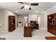 Large home office with custom wood built-ins, desk, and a comfortable executive chair at 607 Lees Mill Rd, Fayetteville, GA 30214