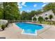 Inviting in-ground pool with patio, fence, and lush greenery, perfect for outdoor enjoyment at 607 Lees Mill Rd, Fayetteville, GA 30214
