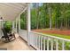 Relaxing porch showcasing rocking chairs and a peaceful view of the surrounding nature at 607 Lees Mill Rd, Fayetteville, GA 30214