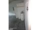 Unfinished basement features concrete flooring, water heater, and door at 115 Lakeview Dr, Stockbridge, GA 30281