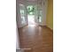 Dining room with hardwood floors, an open door to a deck, and natural light at 115 Lakeview Dr, Stockbridge, GA 30281
