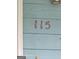 Close-up view of the house number '115' displayed on the exterior of the home at 115 Lakeview Dr, Stockbridge, GA 30281