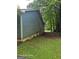 Side yard view of property features grass and mature trees at 115 Lakeview Dr, Stockbridge, GA 30281