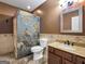 Bathroom featuring stone shower, granite countertop, and tile floors at 335 Canvasback Trl, Locust Grove, GA 30248