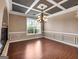 Dining room boasts coffered ceilings, a large picture window and decorative trim at 335 Canvasback Trl, Locust Grove, GA 30248