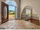 Inviting entryway with tile flooring, decorative front door, and an open view of the yard at 335 Canvasback Trl, Locust Grove, GA 30248