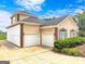 Charming home with a two-car garage and well-manicured landscaping at 335 Canvasback Trl, Locust Grove, GA 30248