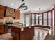Spacious kitchen that features granite counters, stainless steel appliances and a stone hood vent at 335 Canvasback Trl, Locust Grove, GA 30248