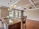 Gourmet kitchen with granite countertops, stainless steel appliances, and breakfast bar at 335 Canvasback Trl, Locust Grove, GA 30248