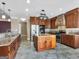 Kitchen with a center island, stainless steel appliances and generous cabinet space at 335 Canvasback Trl, Locust Grove, GA 30248