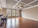Large living area with hardwood floors, coffered ceilings, and plenty of natural light at 335 Canvasback Trl, Locust Grove, GA 30248