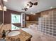 Large bathroom with granite countertops, large tub, and separate shower at 335 Canvasback Trl, Locust Grove, GA 30248