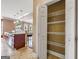 Walk-in pantry provides ample storage space with shelving and easy kitchen access at 335 Canvasback Trl, Locust Grove, GA 30248
