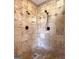 Close-up of the tiled walk-in shower with dual shower heads and soap dish at 335 Canvasback Trl, Locust Grove, GA 30248