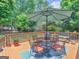 Back deck featuring an outdoor dining area with shade umbrella at 135 Acorn Dr, Mcdonough, GA 30253
