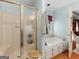 Shower and tub in a bathroom featuring pale blue walls at 135 Acorn Dr, Mcdonough, GA 30253