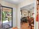 Open entryway revealing a living room with hardwood floors, decorative furniture, and natural light at 135 Acorn Dr, Mcdonough, GA 30253