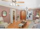 Inviting living room featuring wood floors, ceiling fans, and natural light from the French doors to the outside at 135 Acorn Dr, Mcdonough, GA 30253