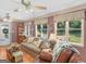 Bright and cozy living room with hardwood floors, lots of natural light, and comfortable seating at 135 Acorn Dr, Mcdonough, GA 30253