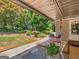 Covered patio featuring an outdoor seating area and lush backyard landscaping at 135 Acorn Dr, Mcdonough, GA 30253