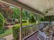 Inviting porch with rocking chairs, ferns, and a 