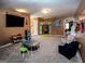 Spacious playroom with stage, TV, play table and sitting area at 500 Hayfield Ct, Locust Grove, GA 30248